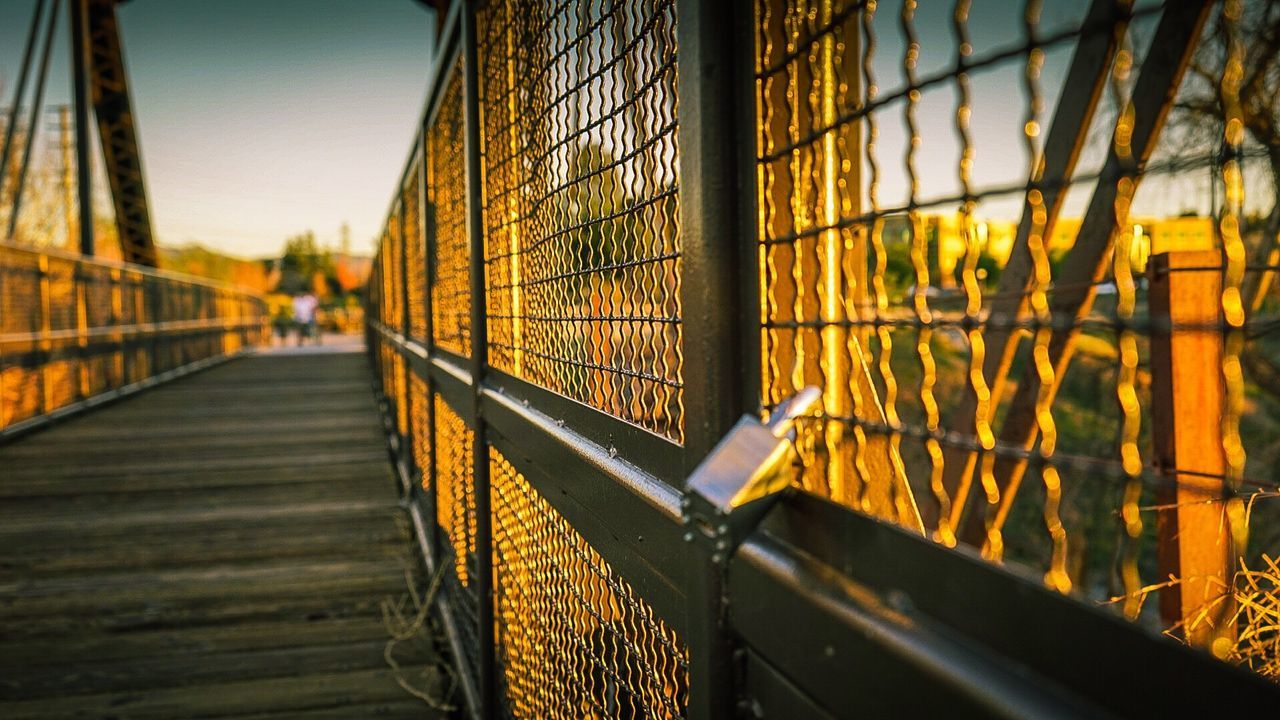 Padlock attached on bridge