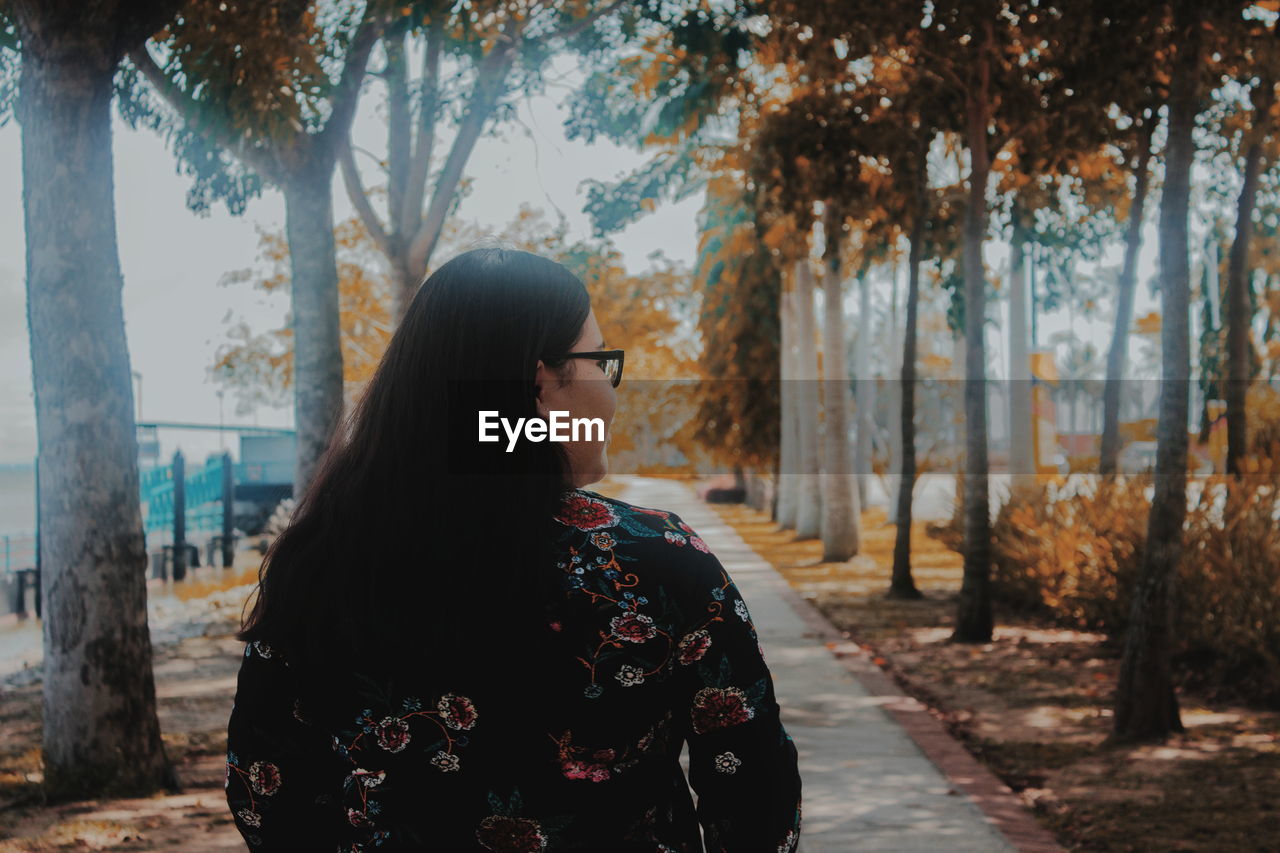 Woman looking away from camera in forest