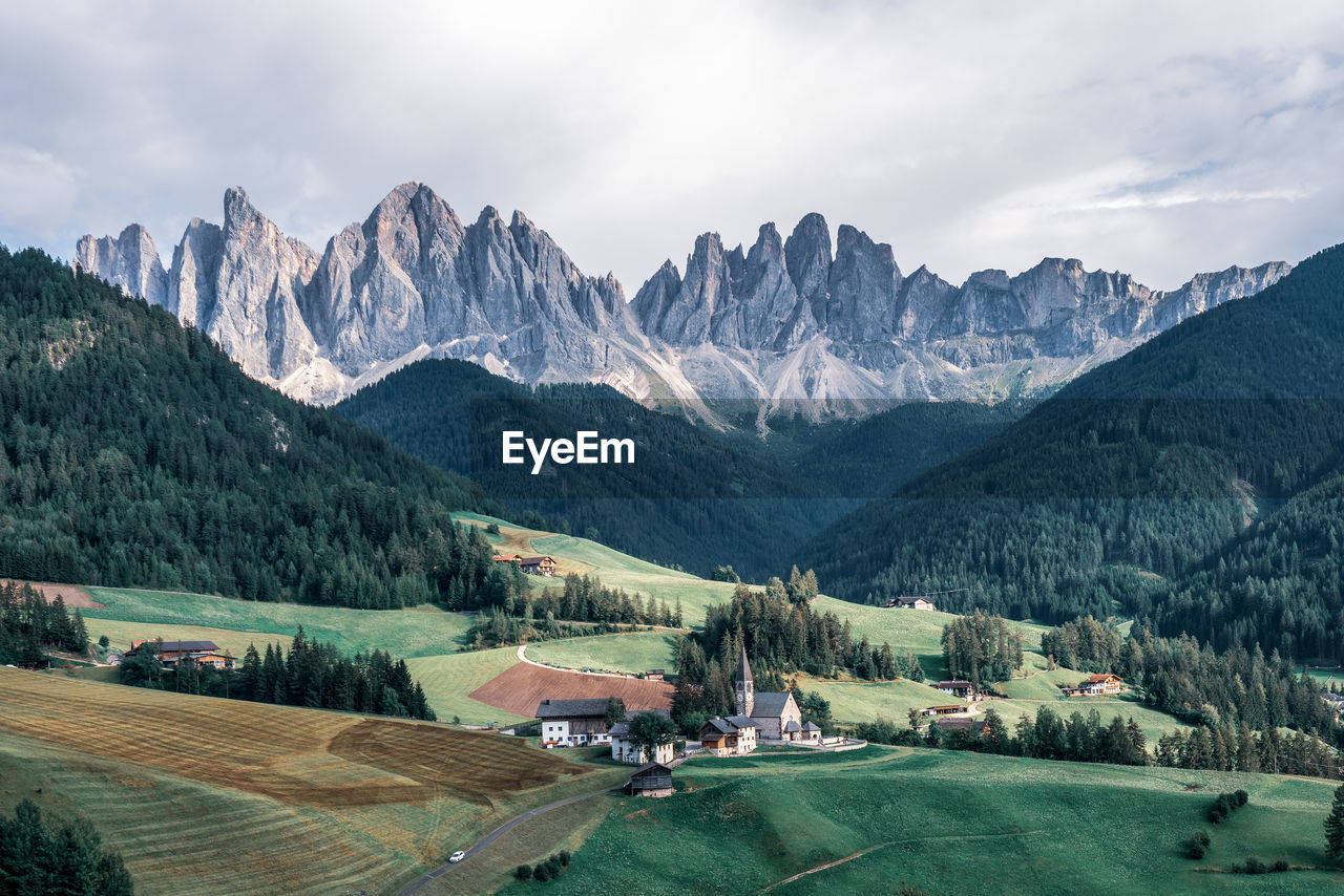 The odle mountain peaks and the church of santa maddalena. sankt maddalena, val di funes in italy.