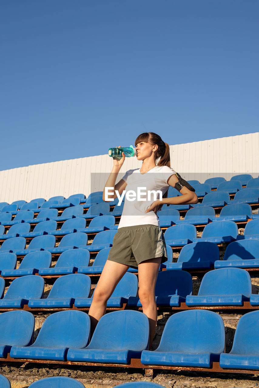 Healthy lifestyle concept. teenage doing sports alone at the empty stadium