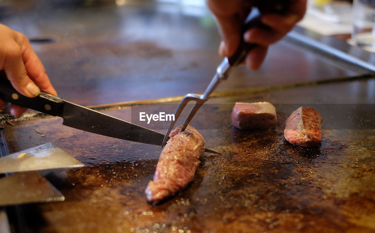 Close-up of man preparing food