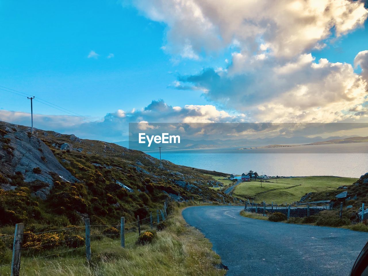 Road to kenmare. a scenic view of road by land against sky