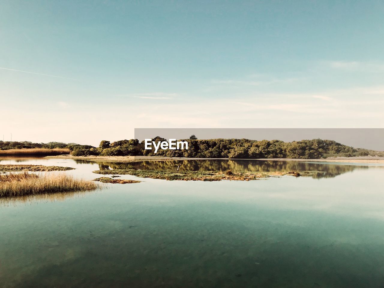 Scenic view of lake against sky