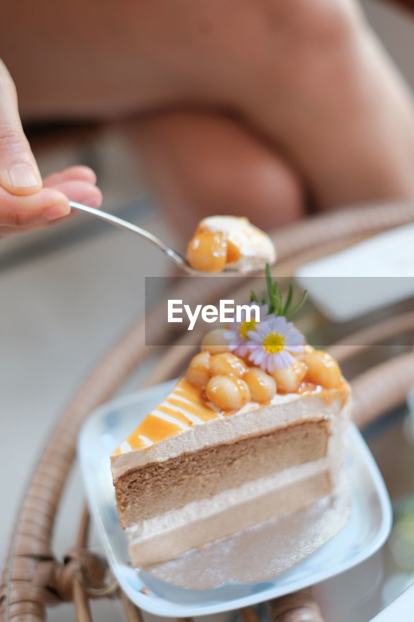food and drink, food, hand, one person, adult, holding, women, freshness, kitchen utensil, eating utensil, sweet food, icing, indoors, sweet, dessert, meal, sweetness, close-up, breakfast, baked, selective focus, spoon, cake, lifestyles, young adult, produce, healthy eating
