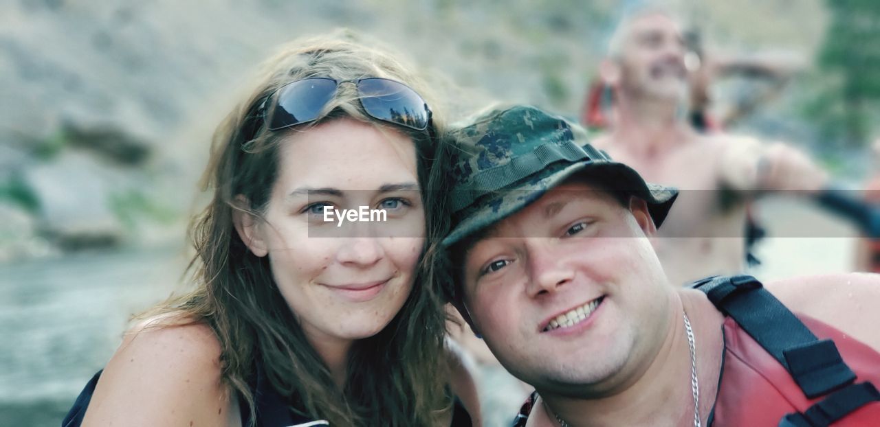 PORTRAIT OF A SMILING YOUNG WOMAN