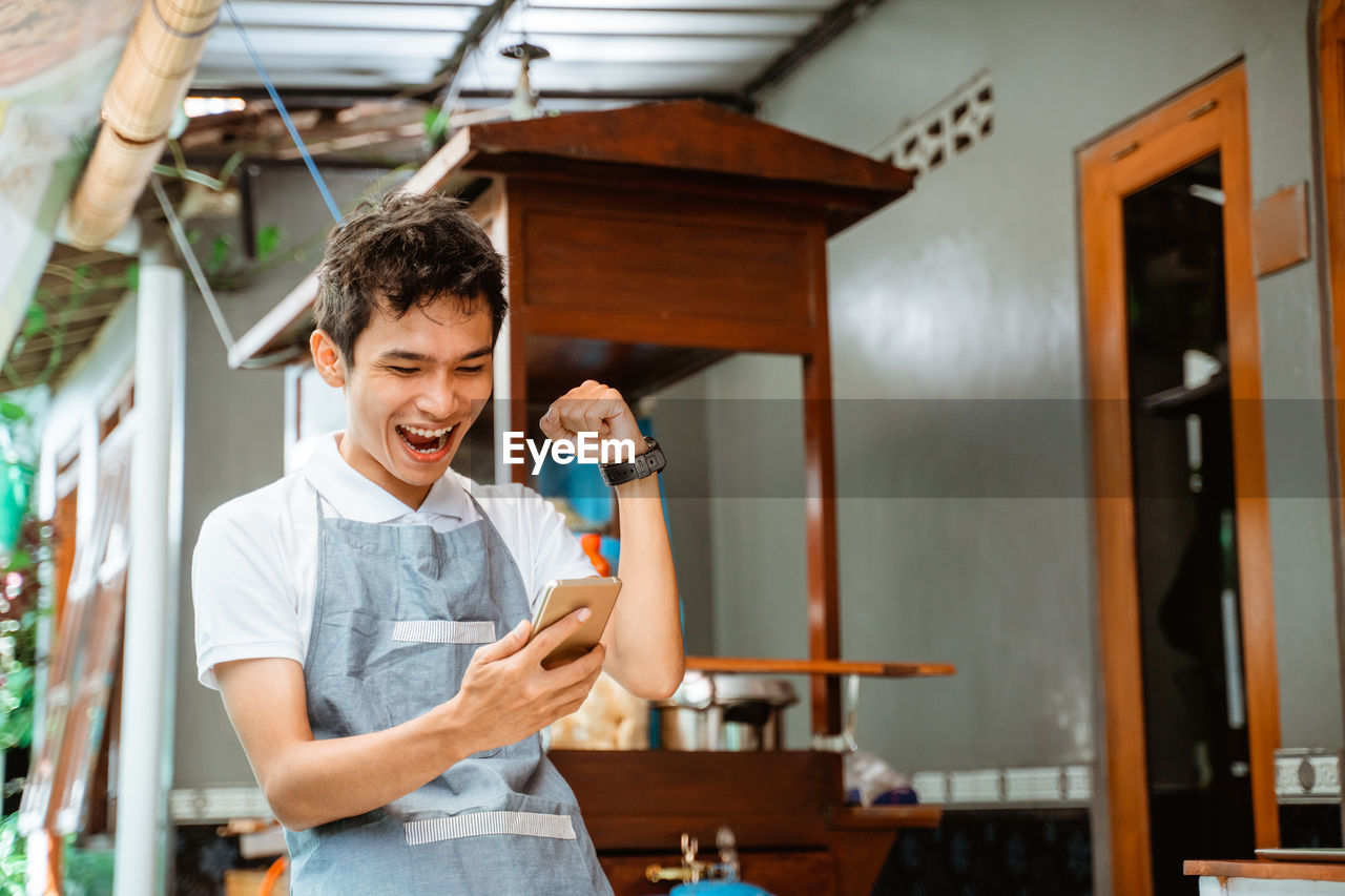 portrait of young man working on table