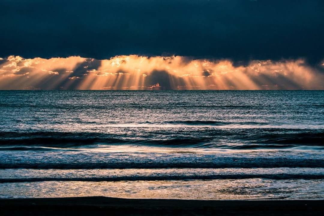 SCENIC VIEW OF SEA DURING SUNSET