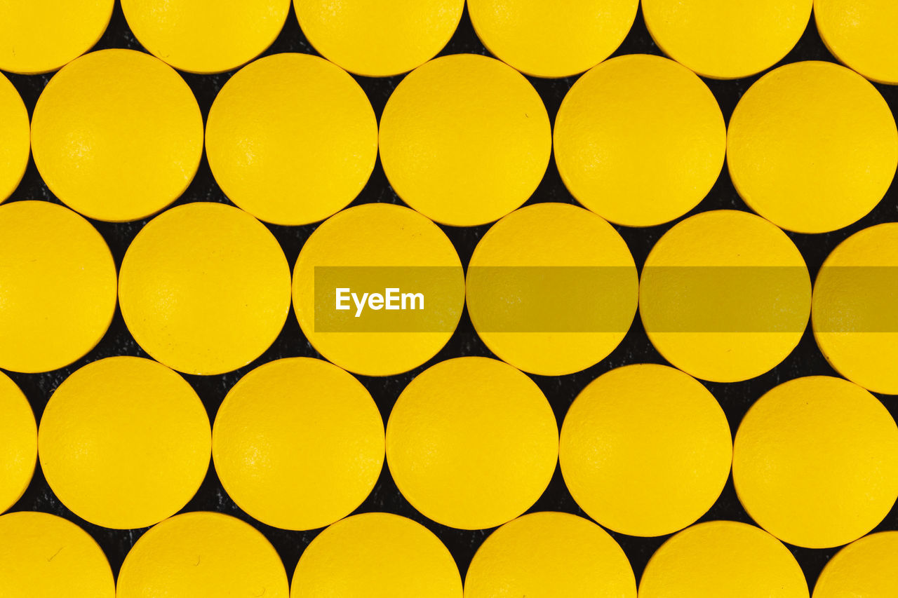 Full frame shot of yellow circular patterns