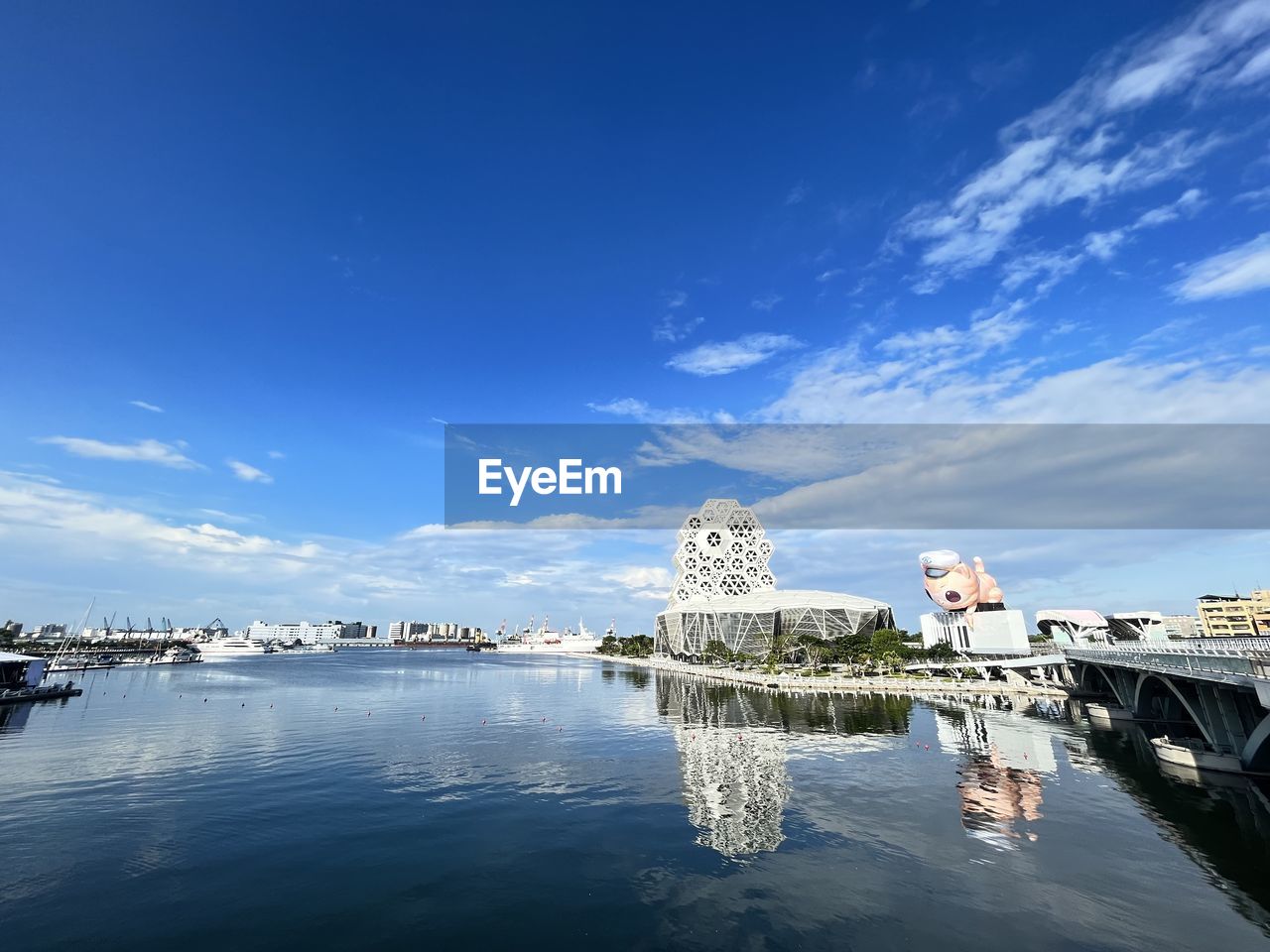 water, sky, architecture, reflection, sea, built structure, travel destinations, nature, horizon, blue, building exterior, cloud, travel, city, transportation, building, coast, ocean, no people, nautical vessel, bay, tourism, outdoors, cityscape, vehicle, day, dusk, scenics - nature, dock, ship, harbor, mode of transportation, marina, vacation, beauty in nature