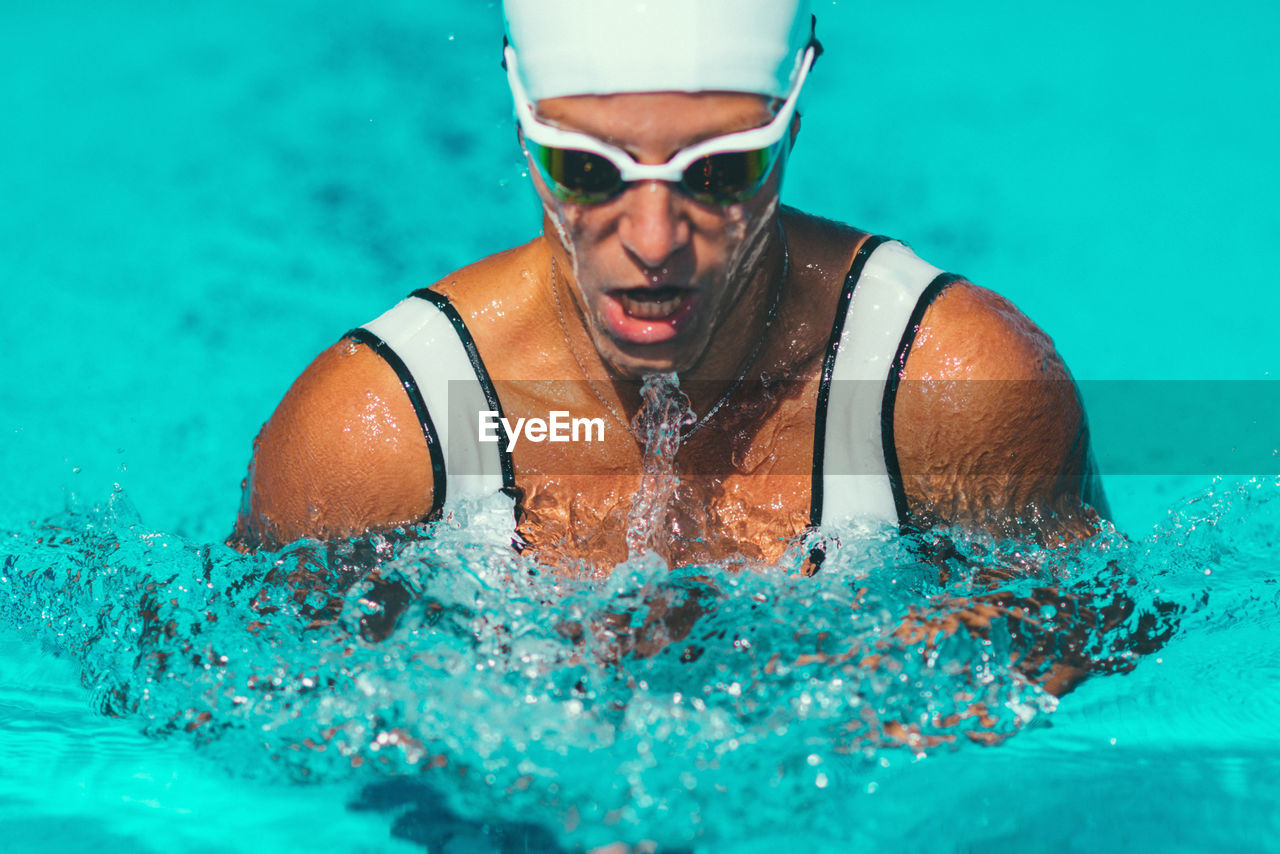 Female athlete swimming in pool