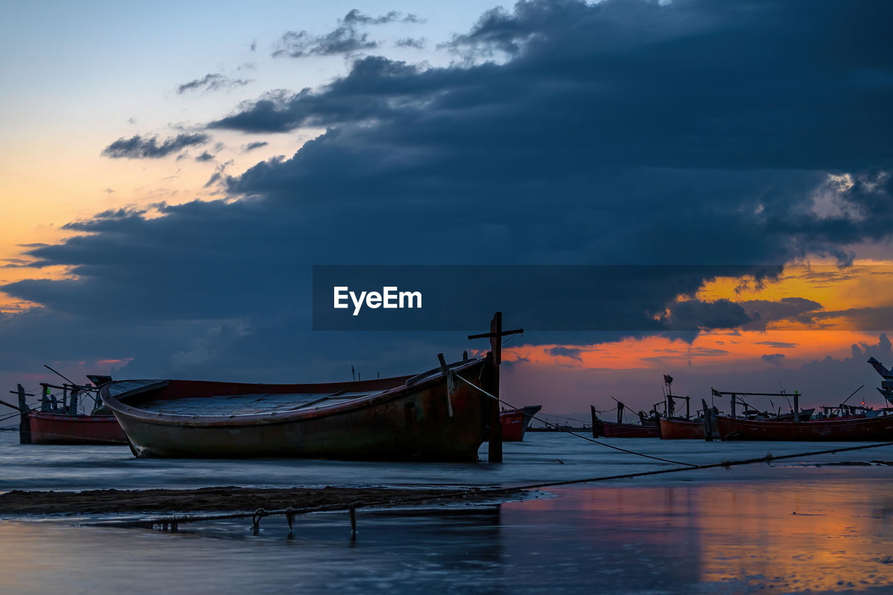 Sunset view with cloudy sky at gadani beach with dhow boat