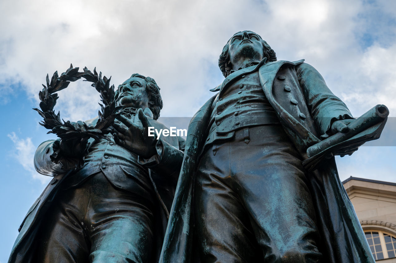 Low angle view of statue against sky