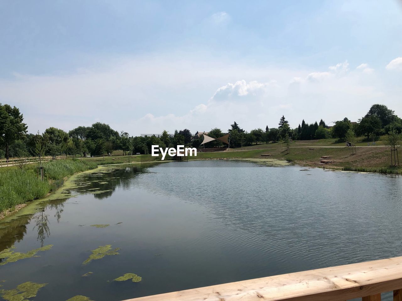 IDYLLIC SHOT OF LAKE AGAINST SKY