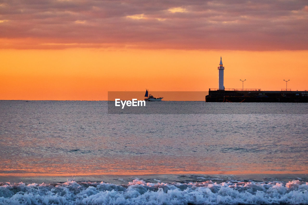 Scenic view of sea against sky during sunrise