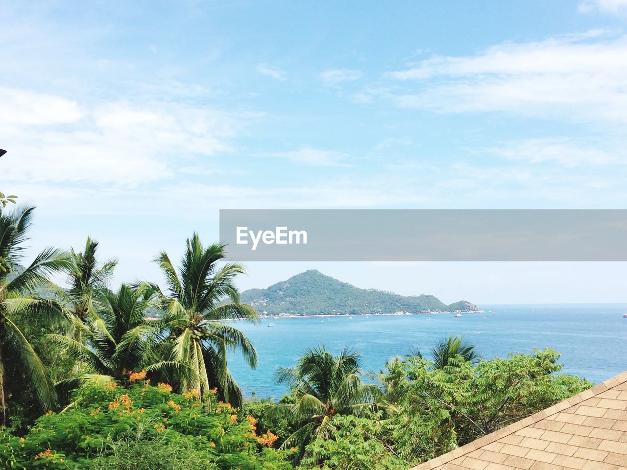 Scenic view of sea and mountain against sky