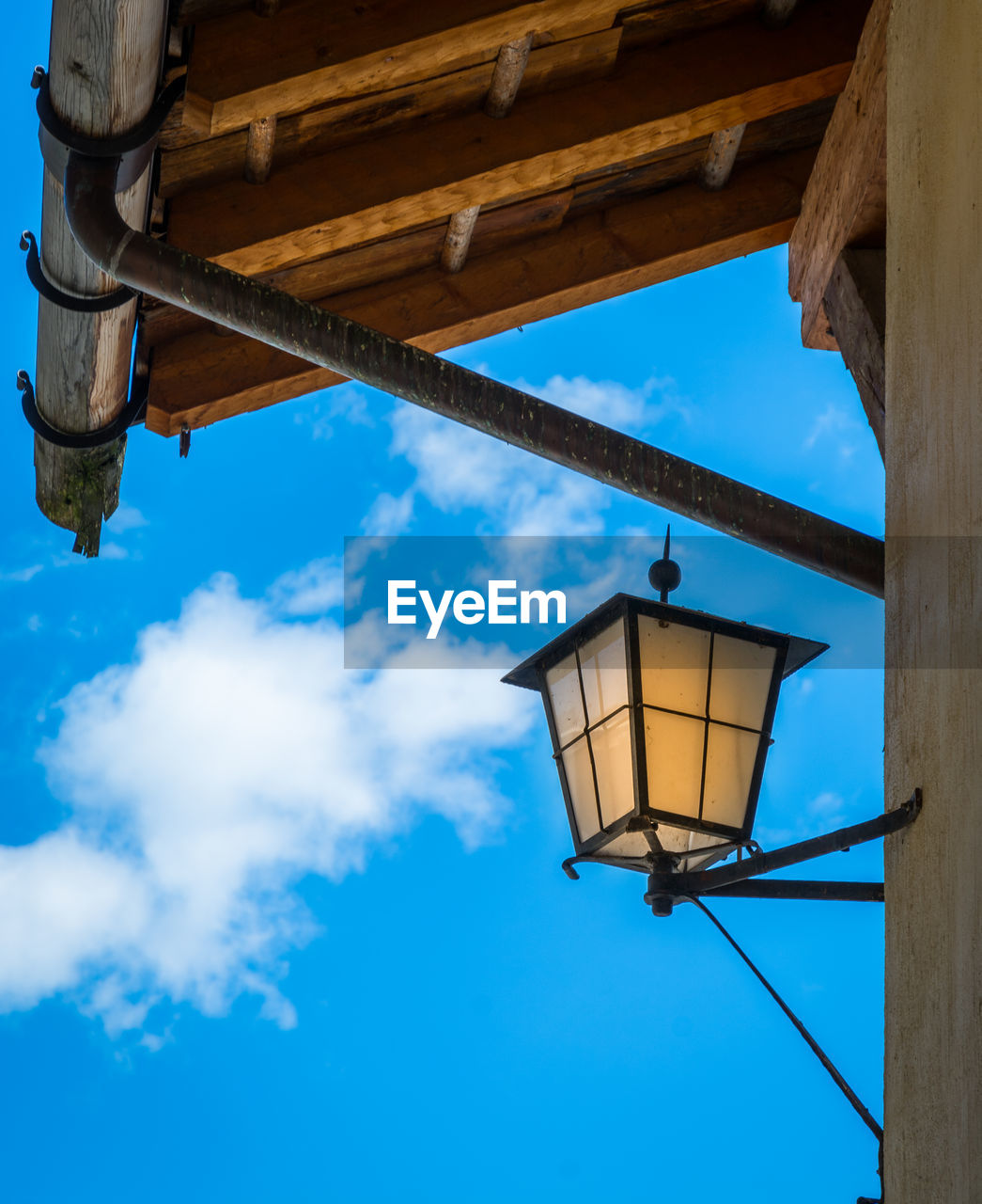 LOW ANGLE VIEW OF HANGING LIGHT AGAINST SKY