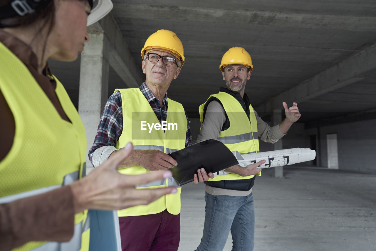 Team of architects working at construction site