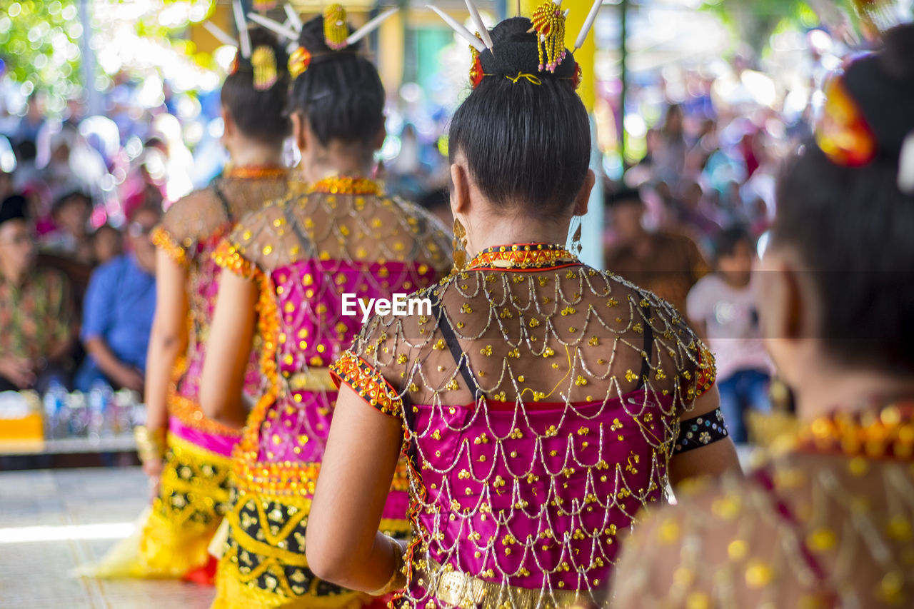 Women in traditional clothing during event