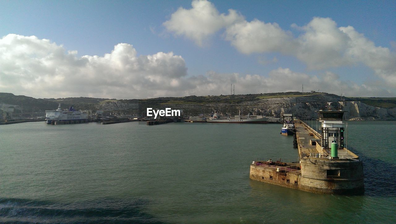 Port of dover against cloudy sky