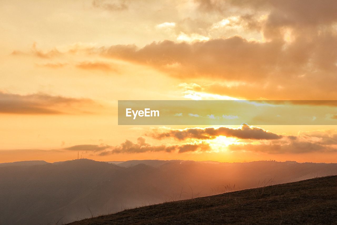 Scenic view of landscape against sky during sunset