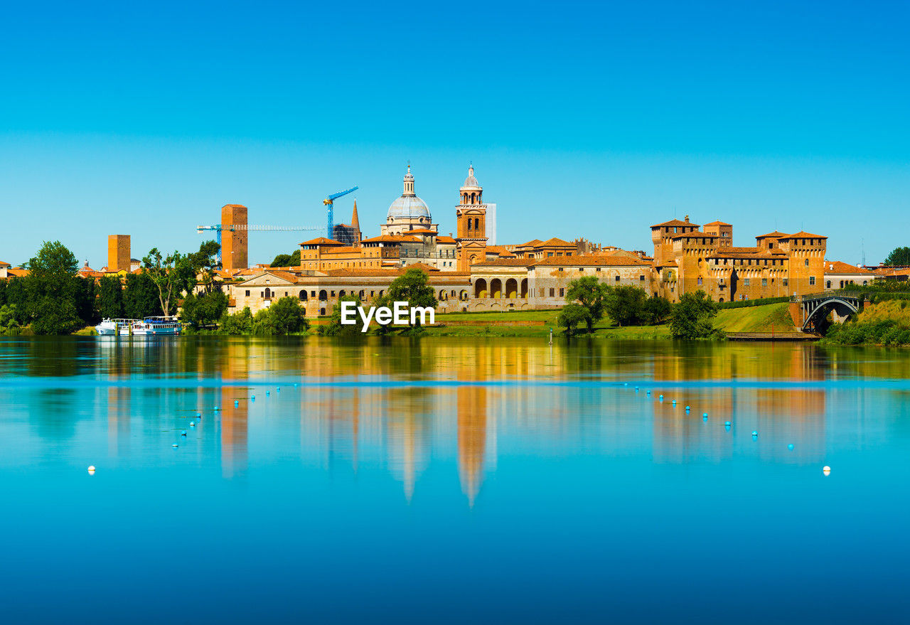 reflection of buildings in lake