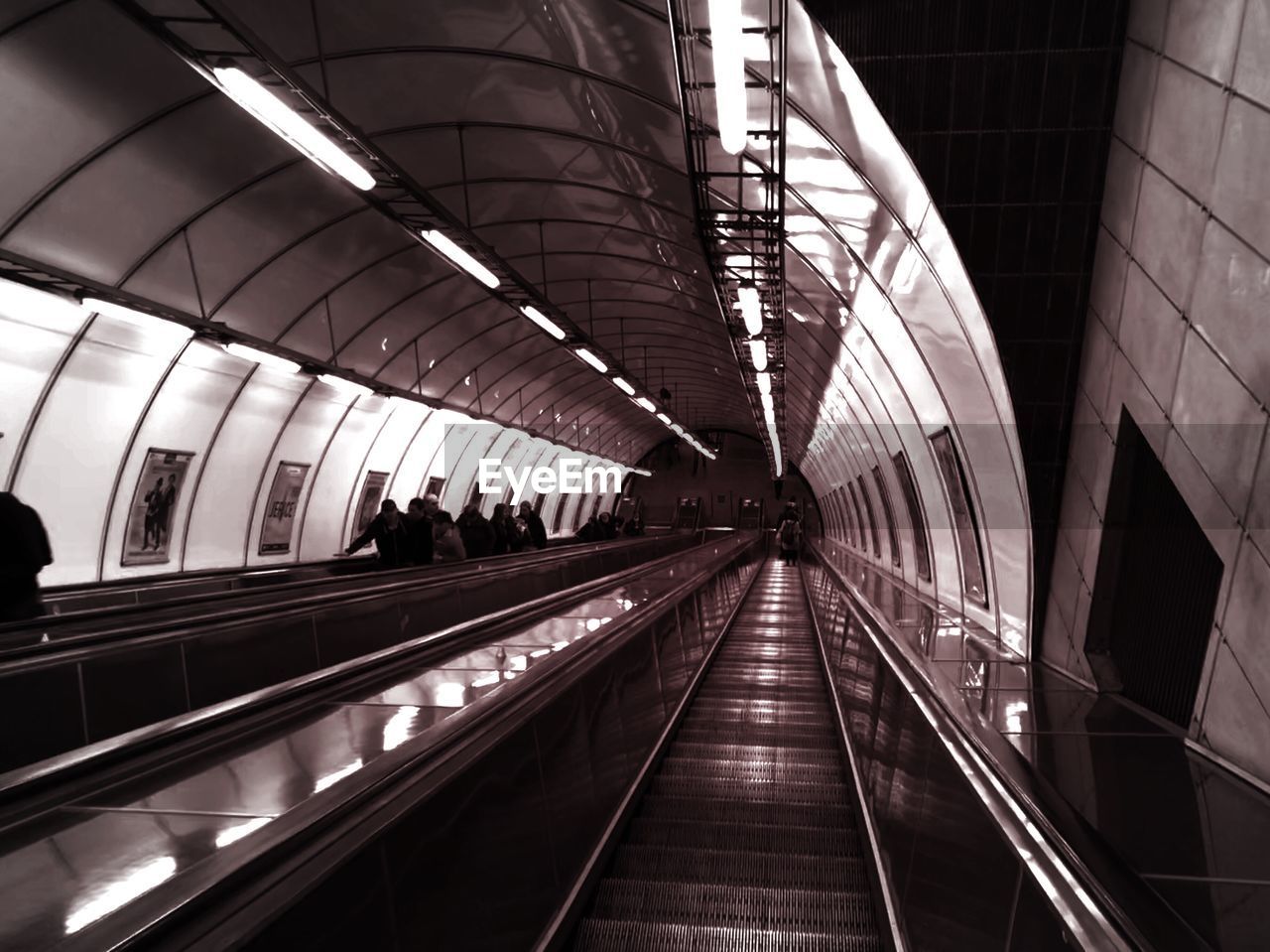 Illuminated escalator at subway station