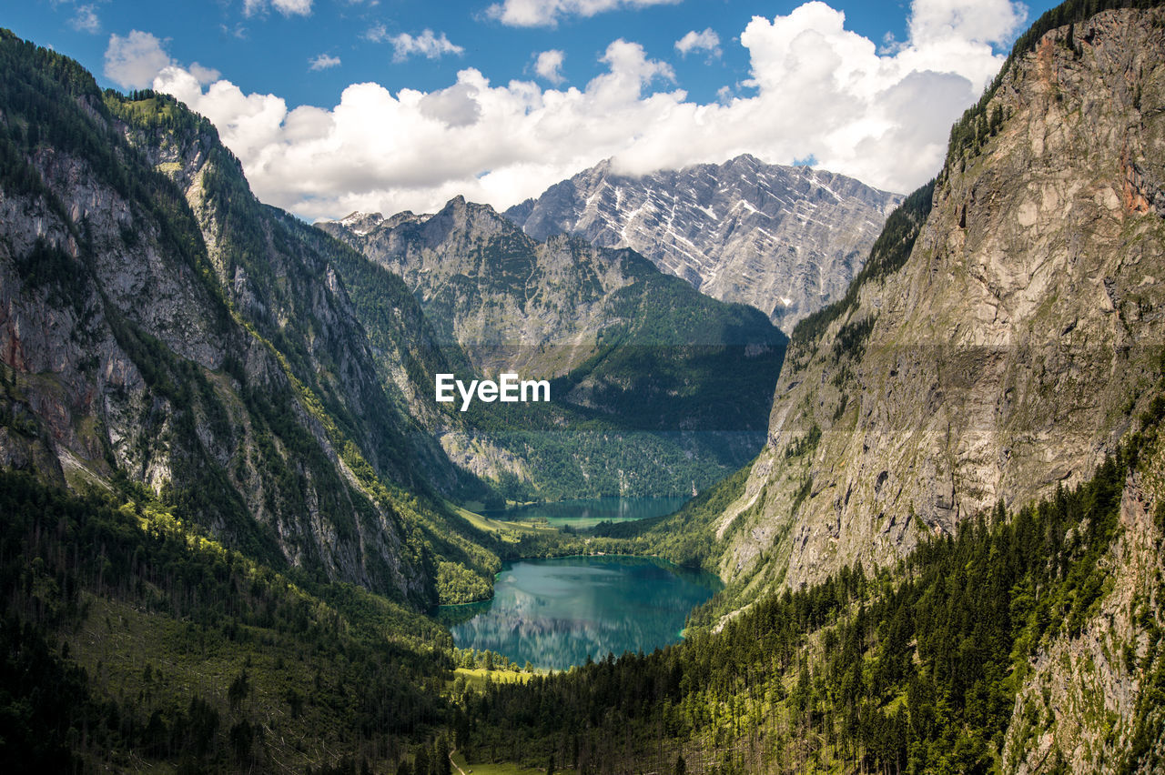 Scenic view of lake and mountains against sky