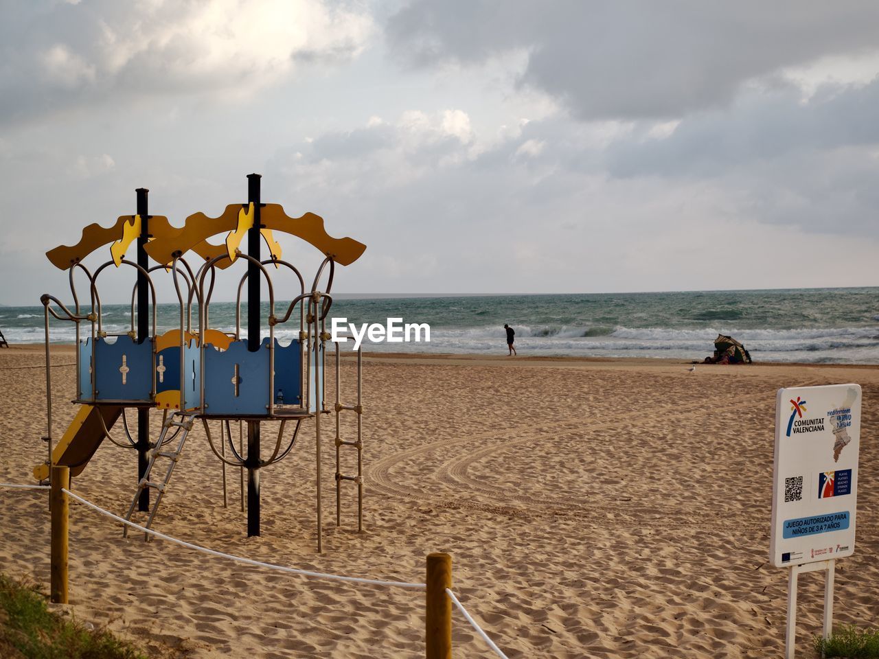beach, sea, land, sky, water, sand, cloud, nature, coast, horizon over water, ocean, shore, horizon, vacation, body of water, lifeguard hut, lifeguard, scenics - nature, trip, holiday, travel destinations, beauty in nature, man made structure, hut, tranquility, walkway, travel, chair, tranquil scene, architecture, outdoors, coastline, protection, summer, day, tourism, no people, security, seat, boardwalk, absence, sunset, water's edge, idyllic, built structure
