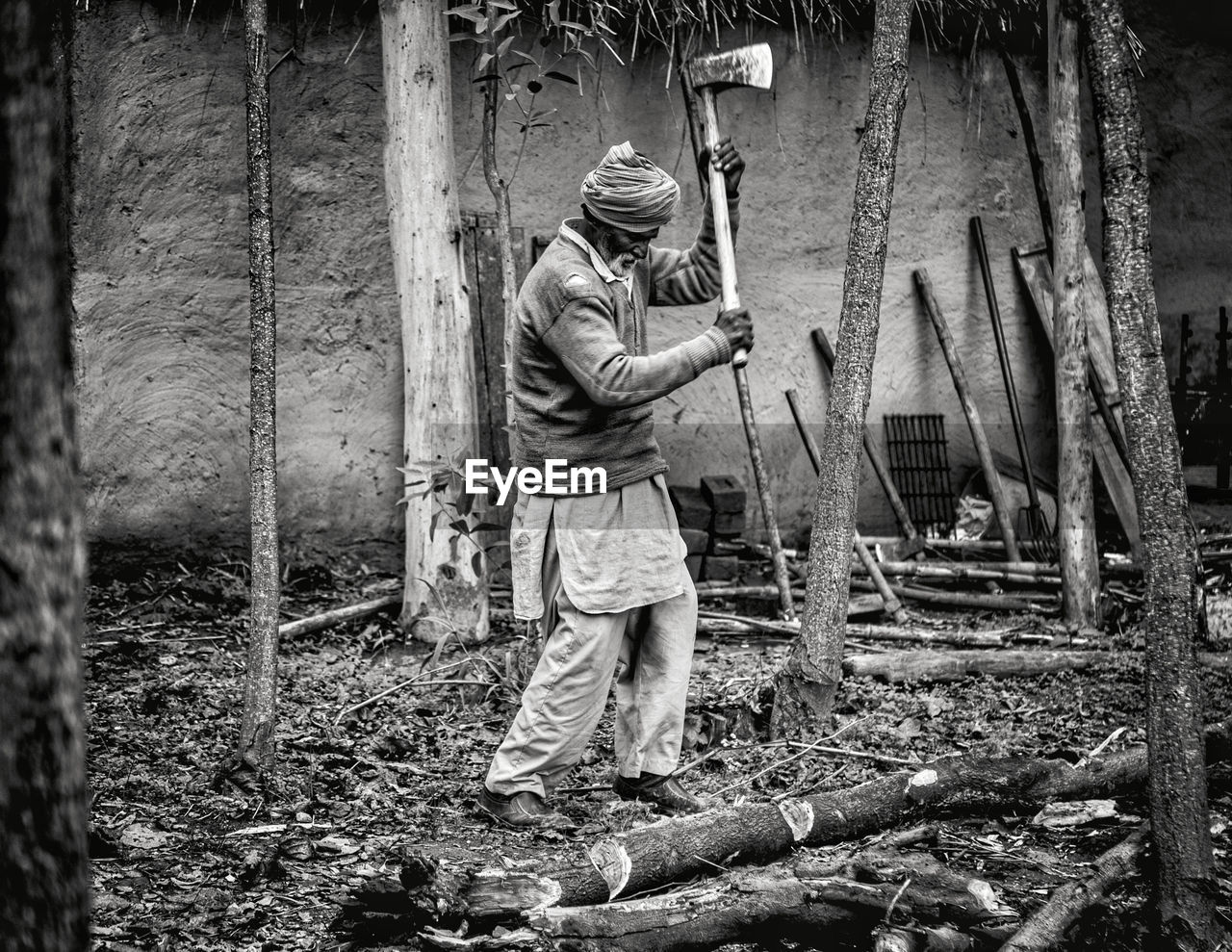 black and white, one person, men, full length, occupation, monochrome, adult, monochrome photography, working, standing, forest, land, nature, plant, tree, day, holding, lifestyles, outdoors, casual clothing, manual worker, protection, wood, weapon, person, tree trunk
