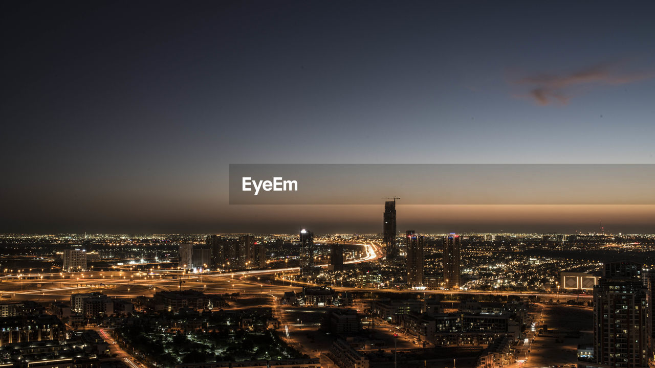 High angle view of city buildings at night