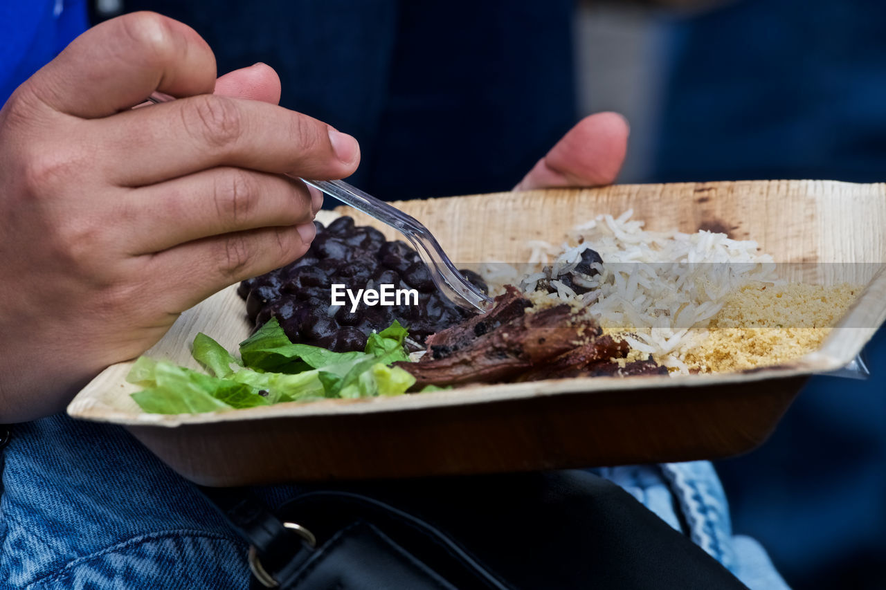 Close-up of man eating food