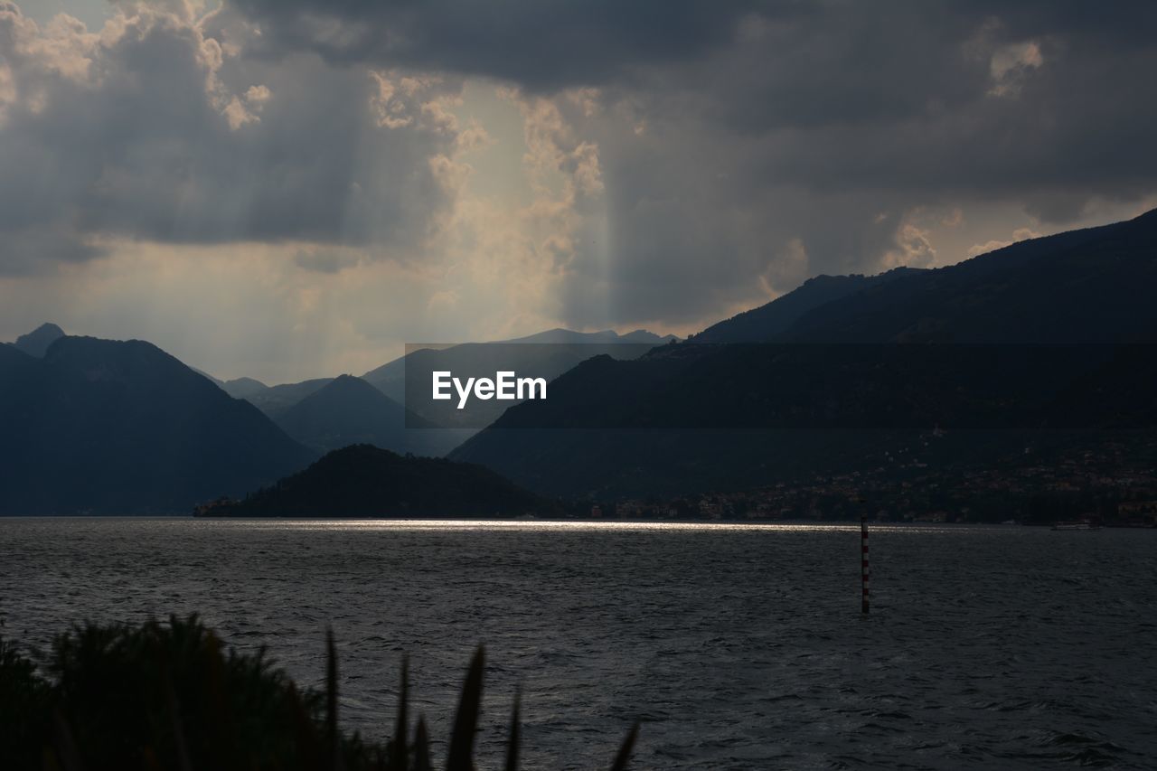 Scenic view of silhouette mountains against sky during sunset
