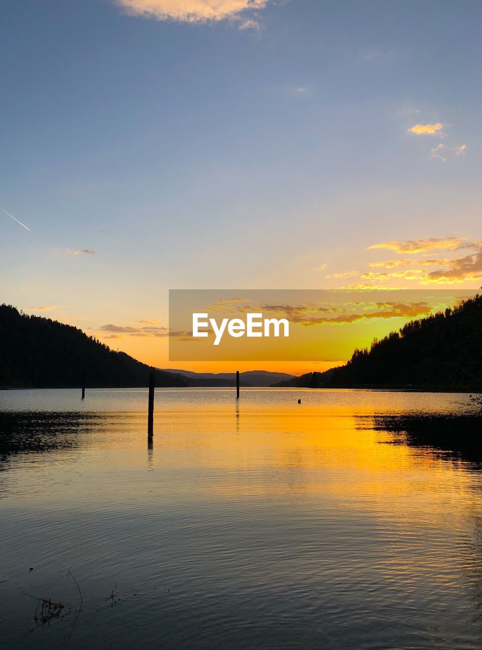 SCENIC VIEW OF LAKE DURING SUNSET