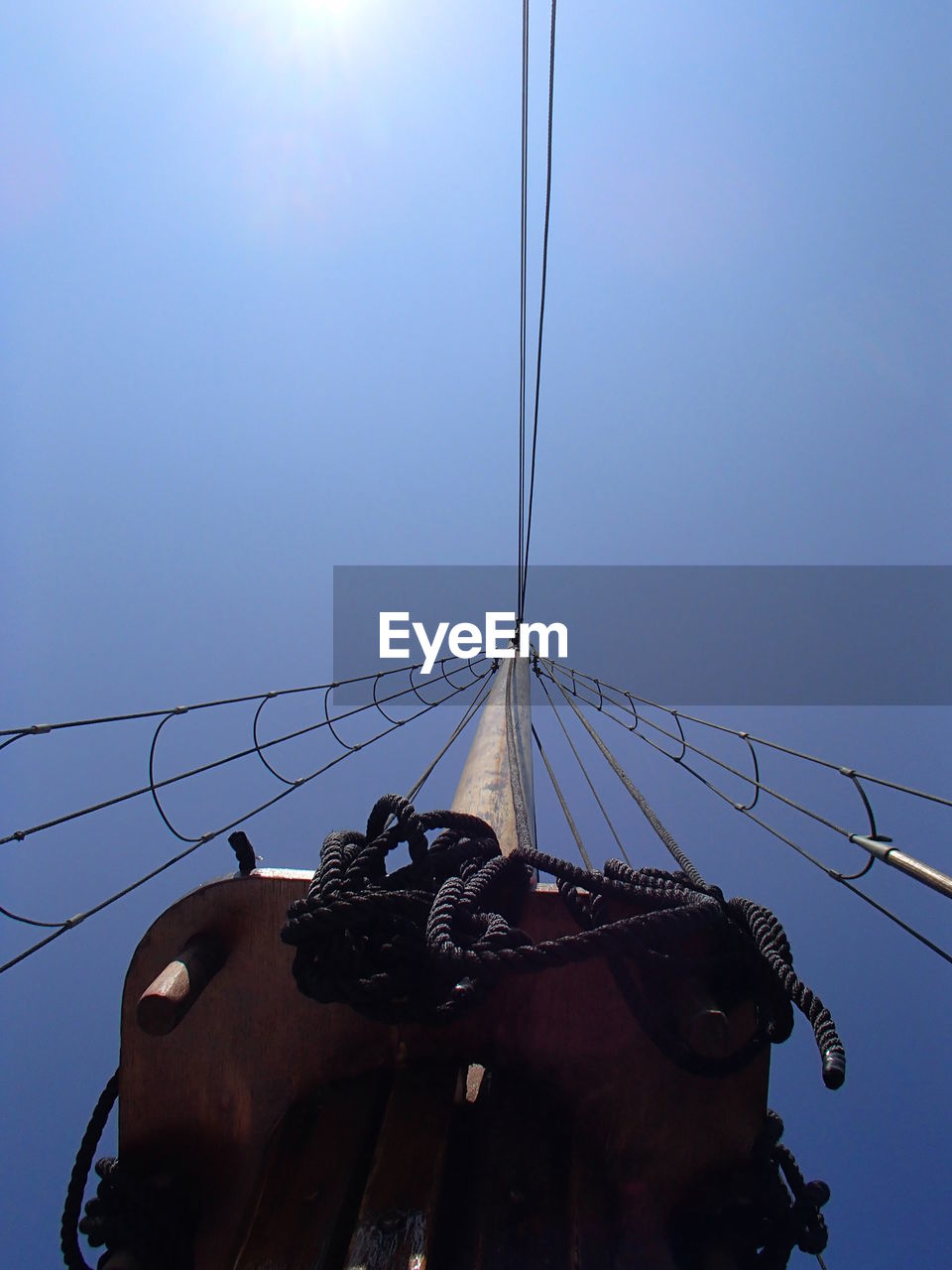 Low angle view of boat mast against clear sky