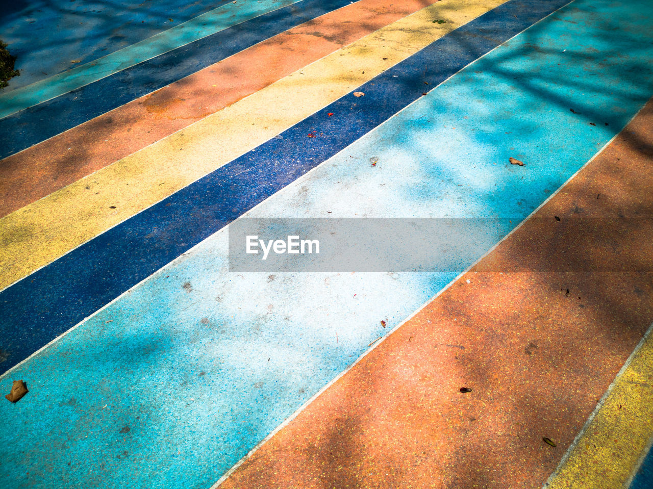 HIGH ANGLE VIEW OF MULTI COLORED ON FLOOR