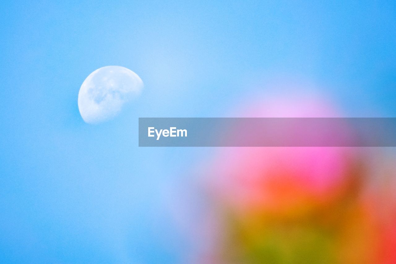 LOW ANGLE VIEW OF MOON AGAINST SKY AT NIGHT