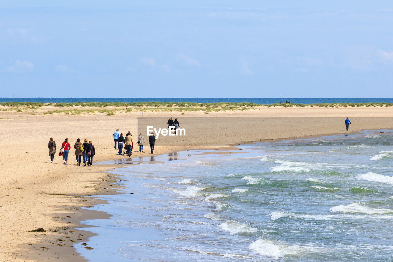 People who walk on the beach in skagen. danmark