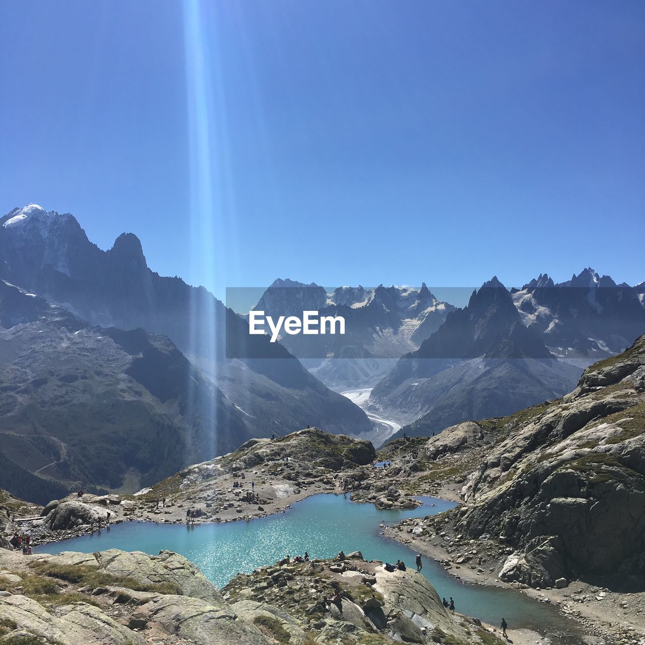 Scenic view of mountains against clear blue sky