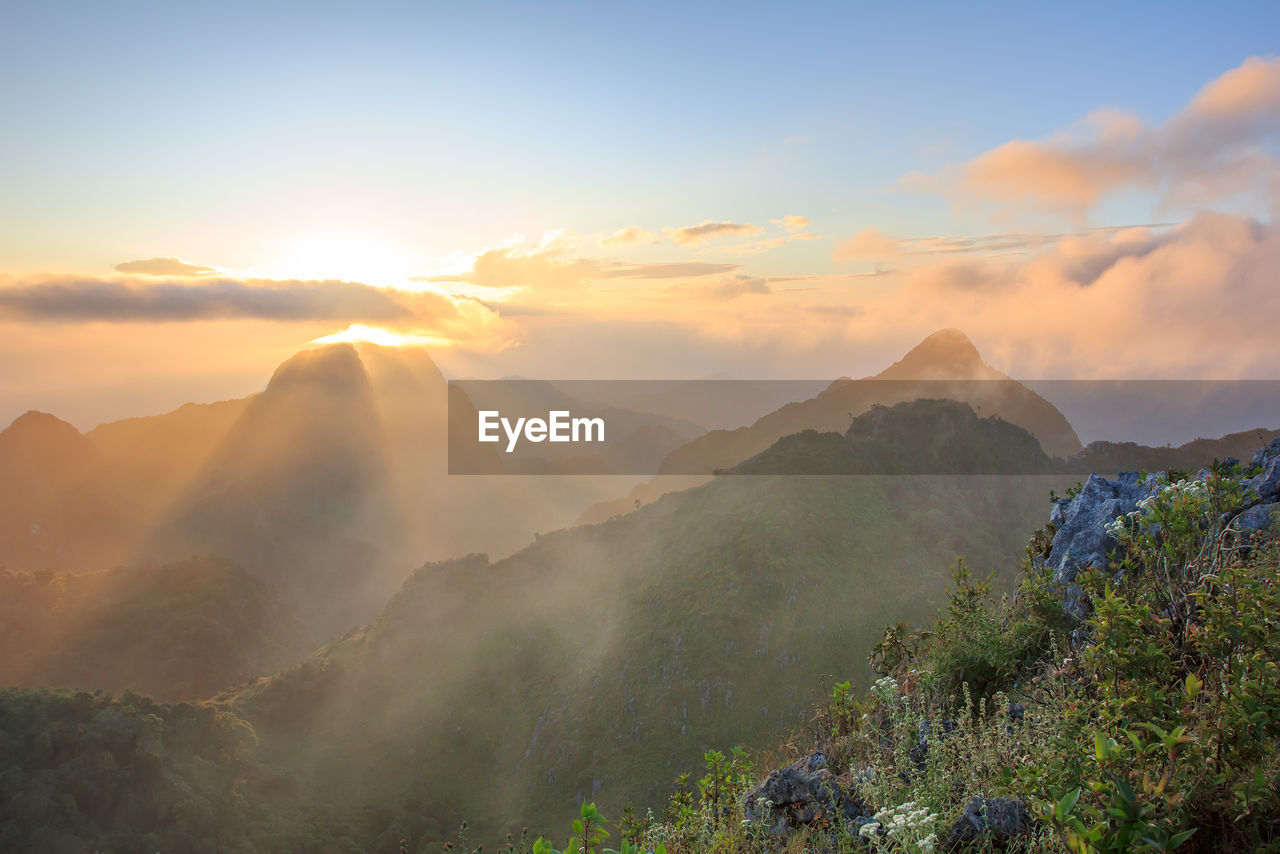 SCENIC VIEW OF MOUNTAINS DURING SUNSET