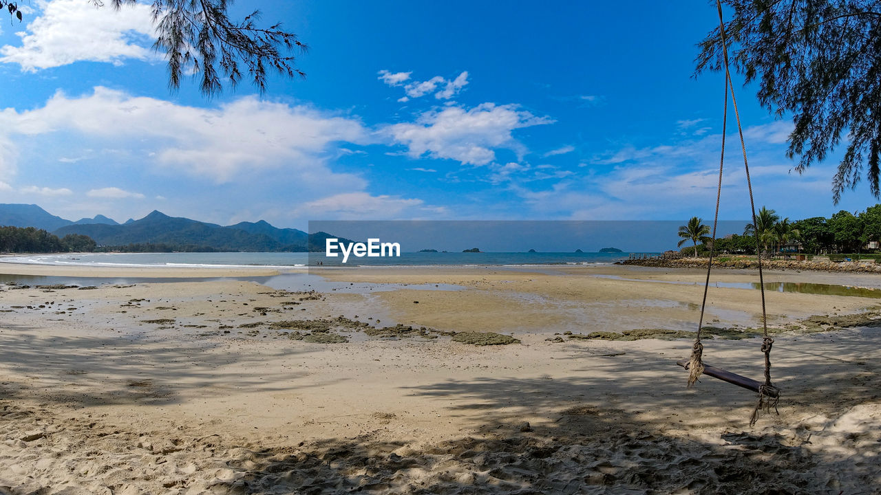 Scenic view of beach against sky