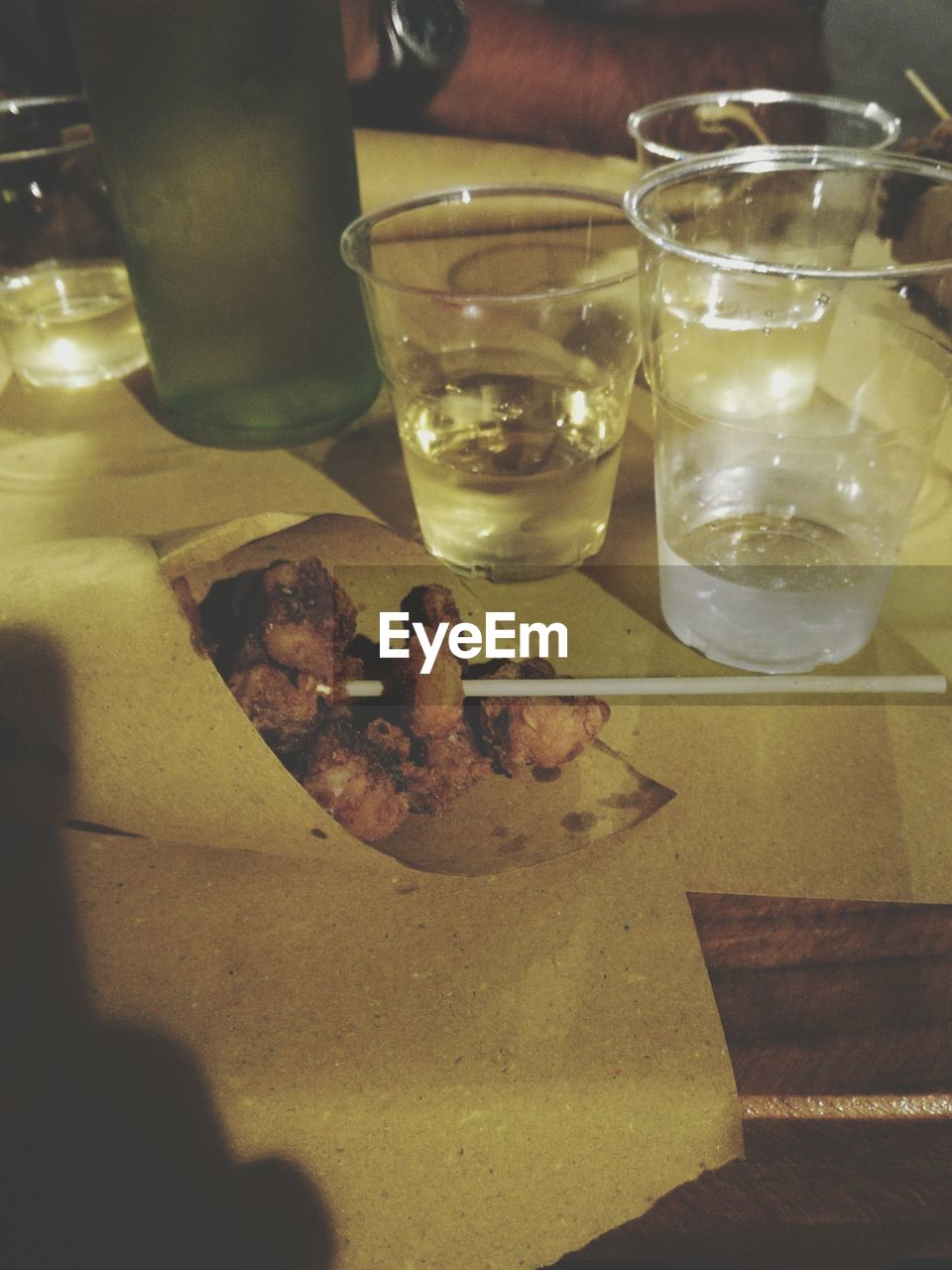 CLOSE-UP OF BEER ON TABLE