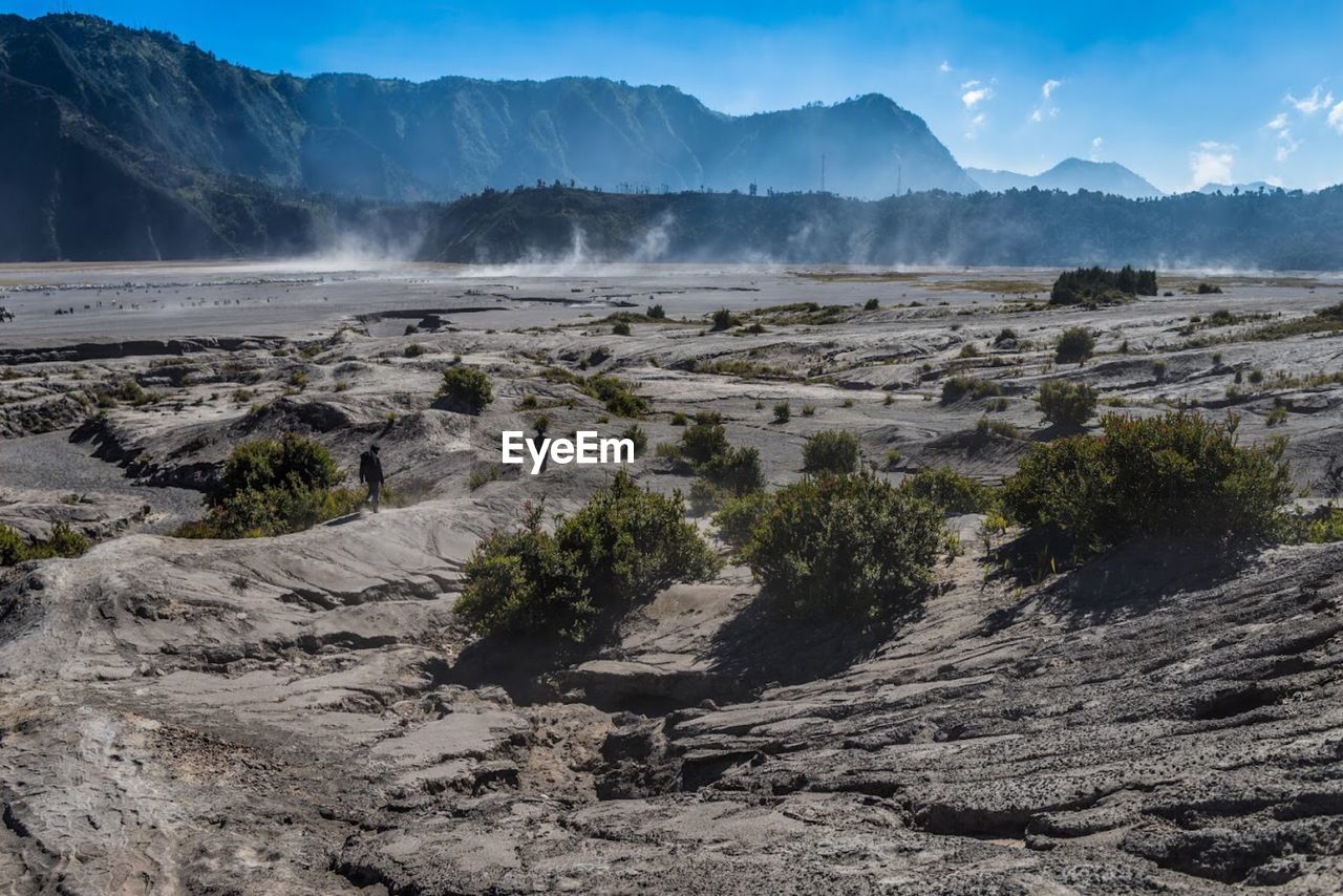 Scenic view of landscape and mountains against sky