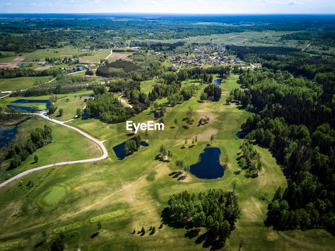 HIGH ANGLE VIEW OF GOLF COURSE ON LANDSCAPE