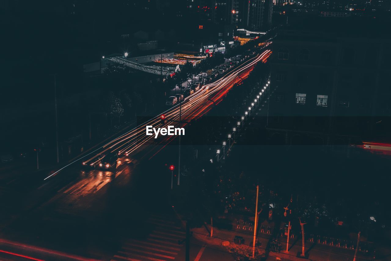 High angle view of light trails on road at night