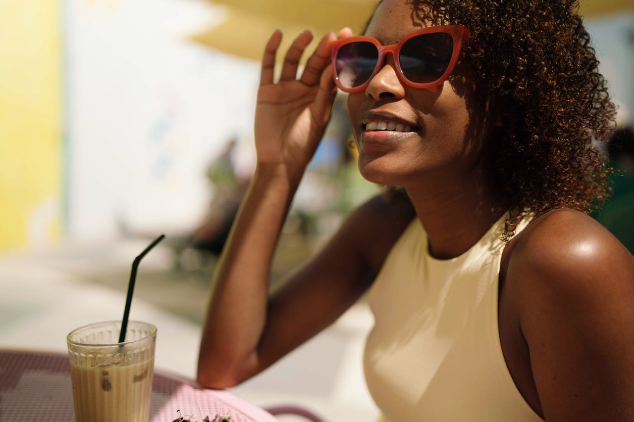 Woman sitting in the outdoor cafe