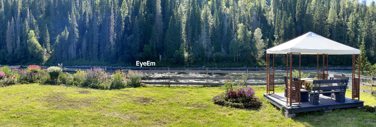 Garden with a gazebo near river. beautiful place for celebrations, altai, russia 