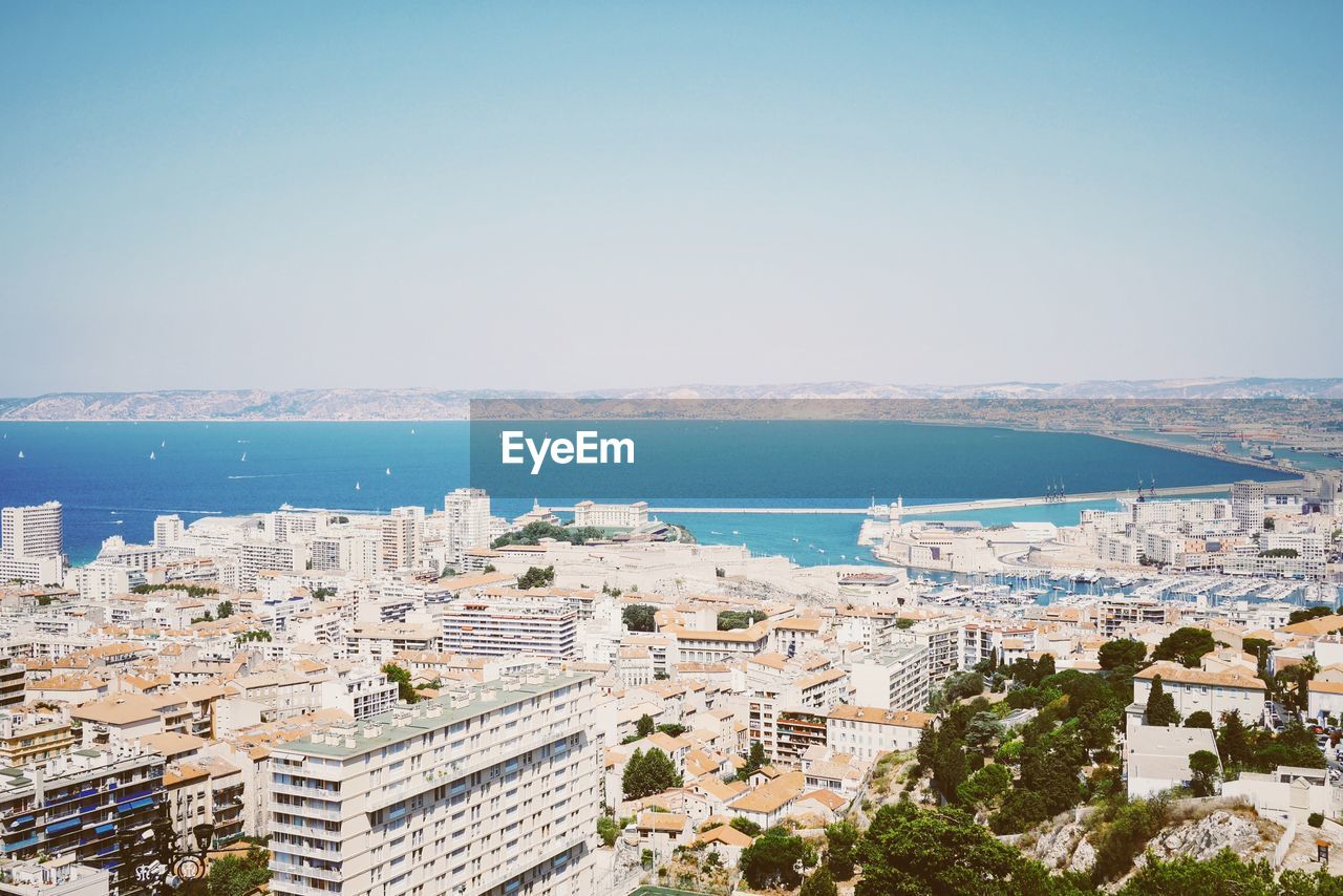 View of sea with cityscape in background