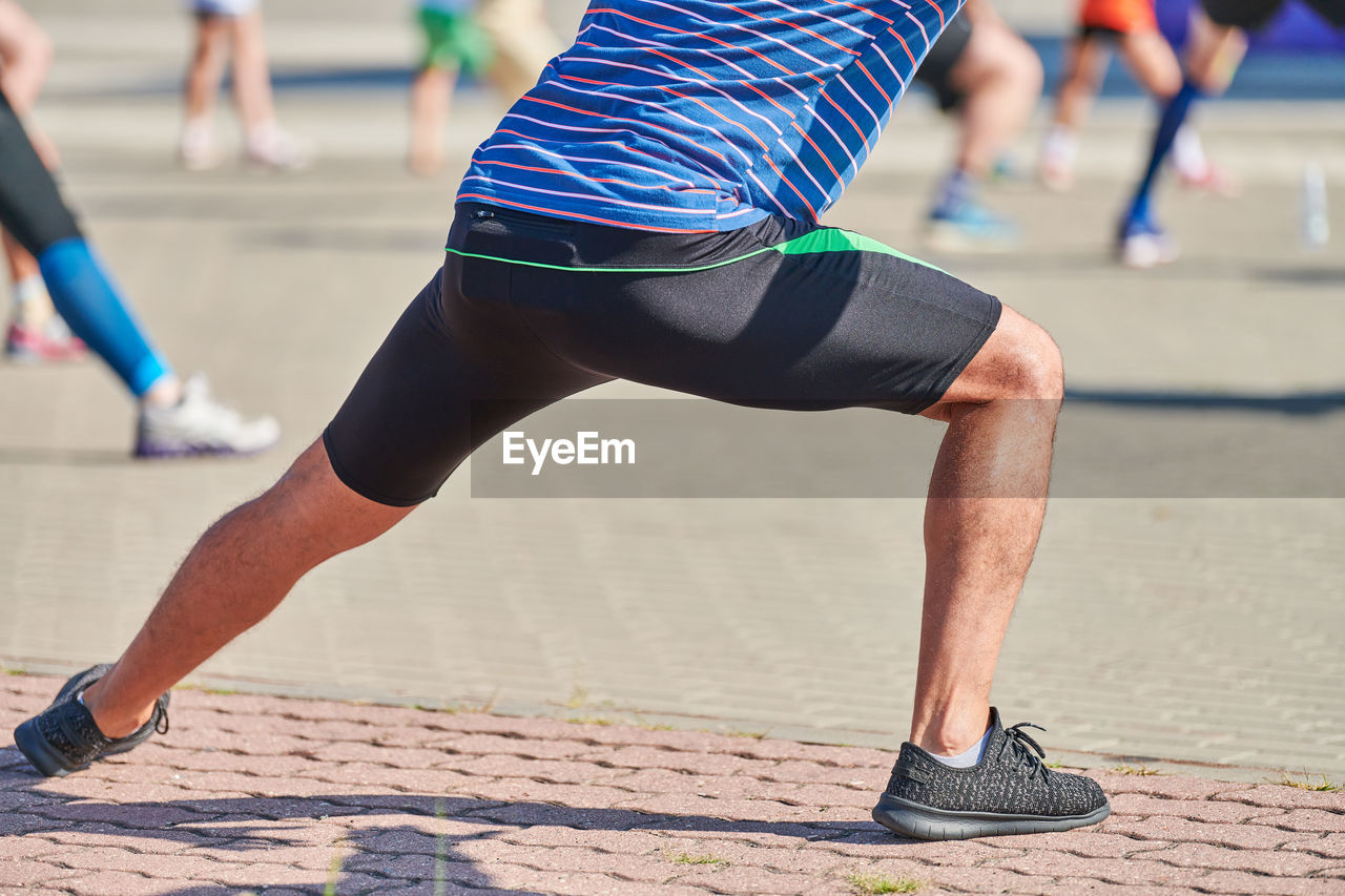 Low section of man exercising outdoors