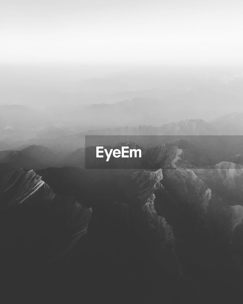 Aerial view of landscape against sky during foggy weather