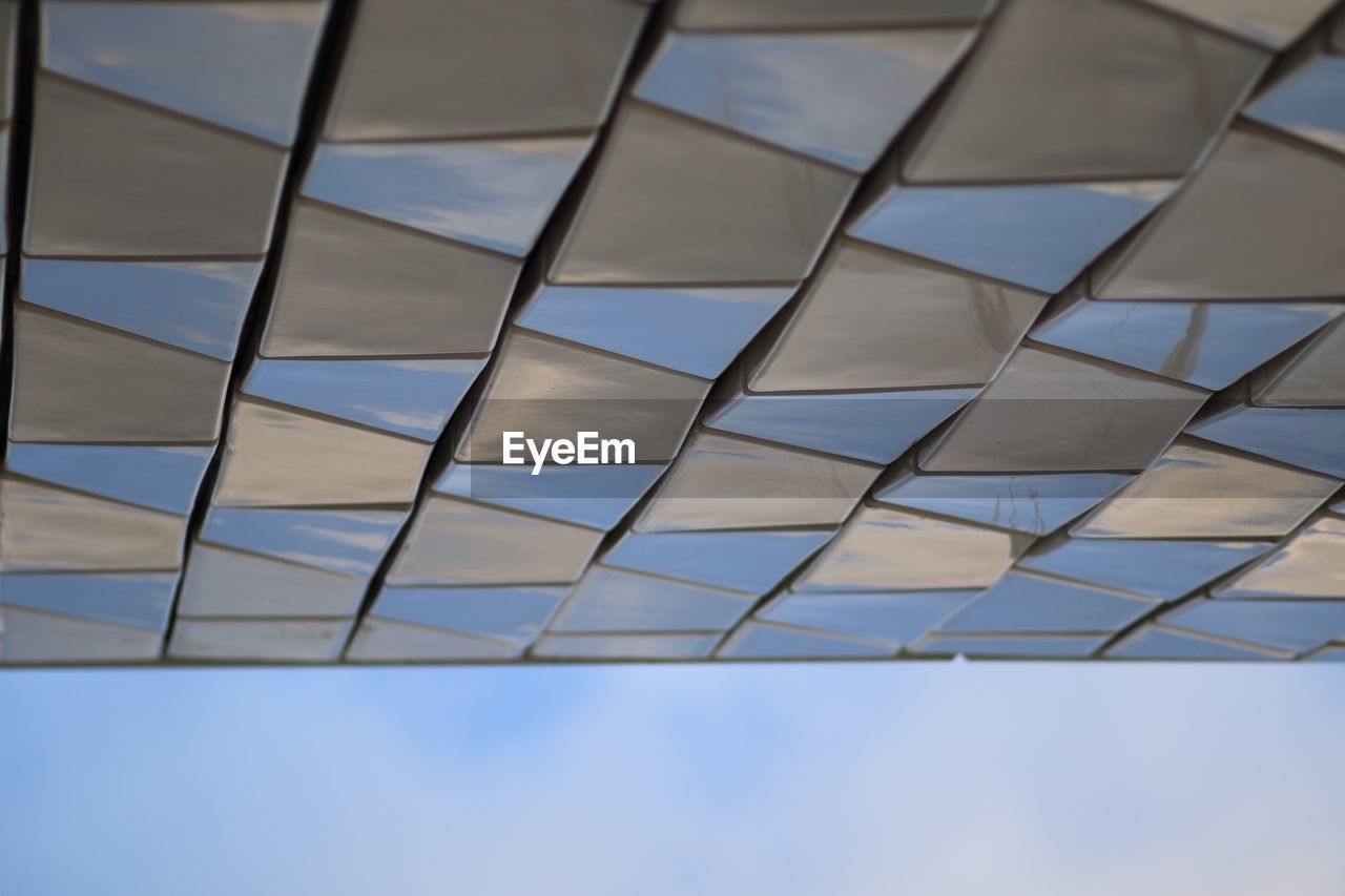 LOW ANGLE VIEW OF OFFICE BUILDING AGAINST SKY